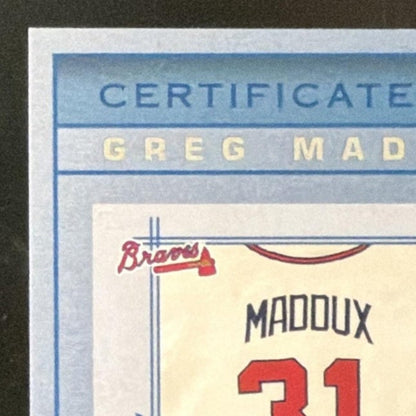 2001 Absolute Memorabilia Tools of the Trade Greg Maddux Patch /300 card - back top left corner close-up